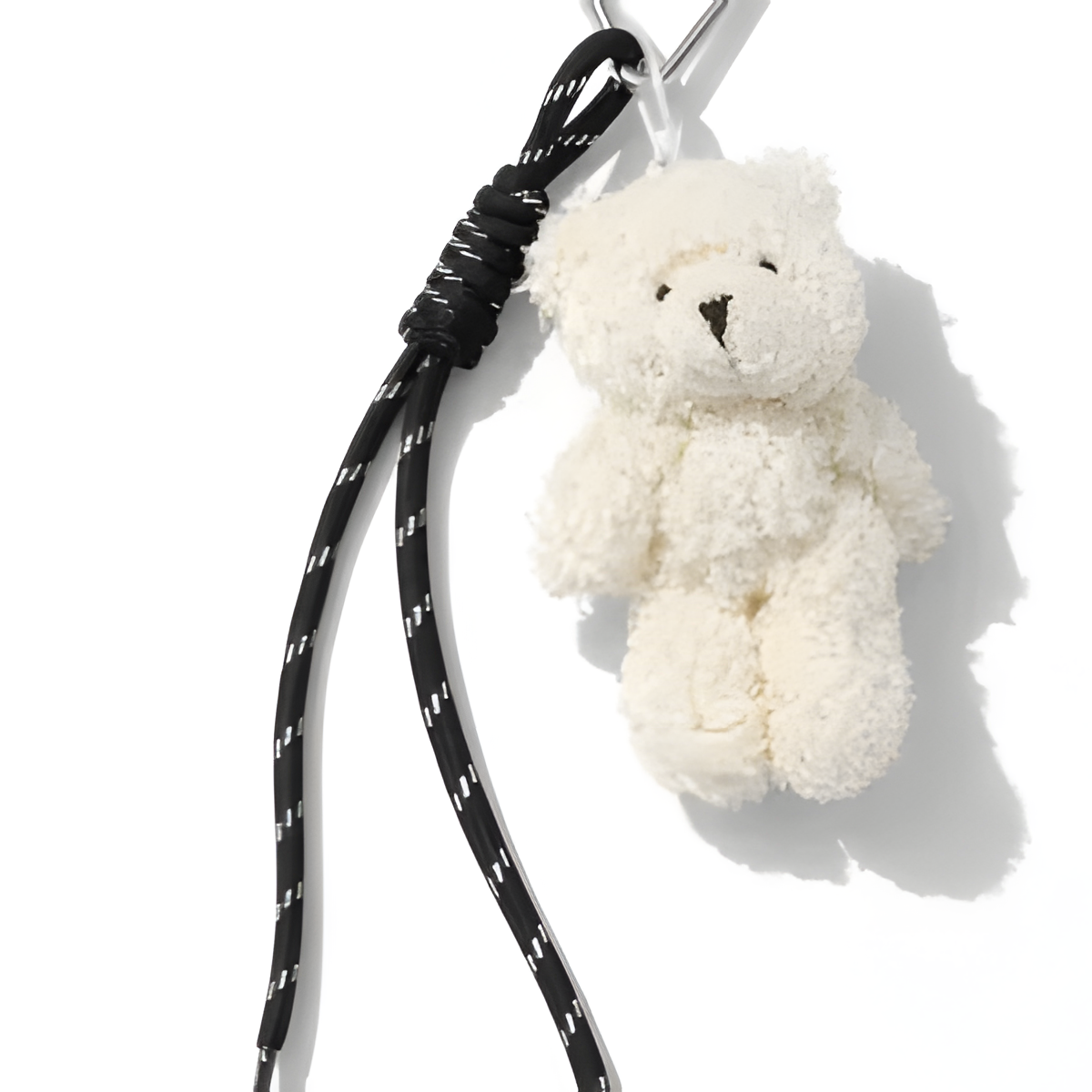 white bag charm